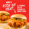 A sandwich with fried chicken, pickles, and a spicy sauce, with the text 'Adds a kick of heat &amp; a whole lot of flavor to favorite foods' on a red background.
