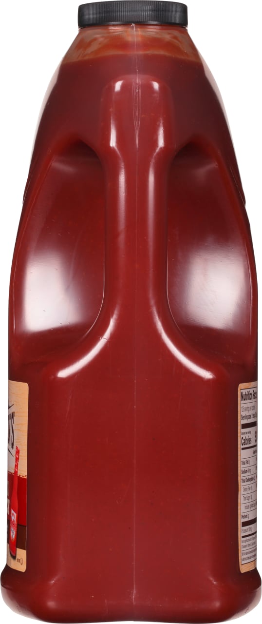 ["A red plastic jug of Bull's-Eye Original Barbecue Sauce."]