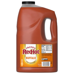 A one-gallon jug of Franks Red Hot Original Buffalo Wing Hot Sauce Red Hot 128 Oz is shown against a white background, highlighting the product's label and nutritional information.