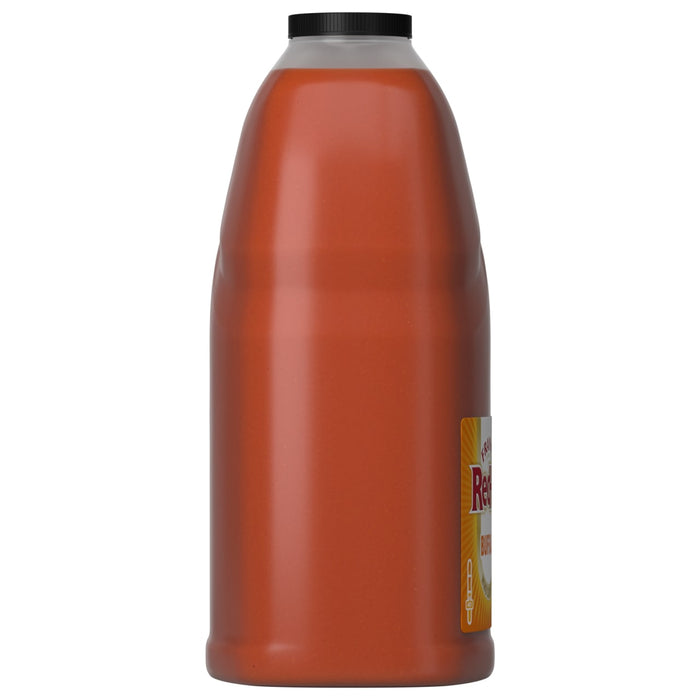 A side view of a large jug of Franks Red Hot Original Buffalo Wing Hot Sauce Red Hot 128 Oz, showing the opaque red sauce and black cap against a white background.