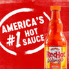 A bottle of Franks RedHot Wings Buffalo sauce with a white circle around it that says Americas #1 Hot Sauce.