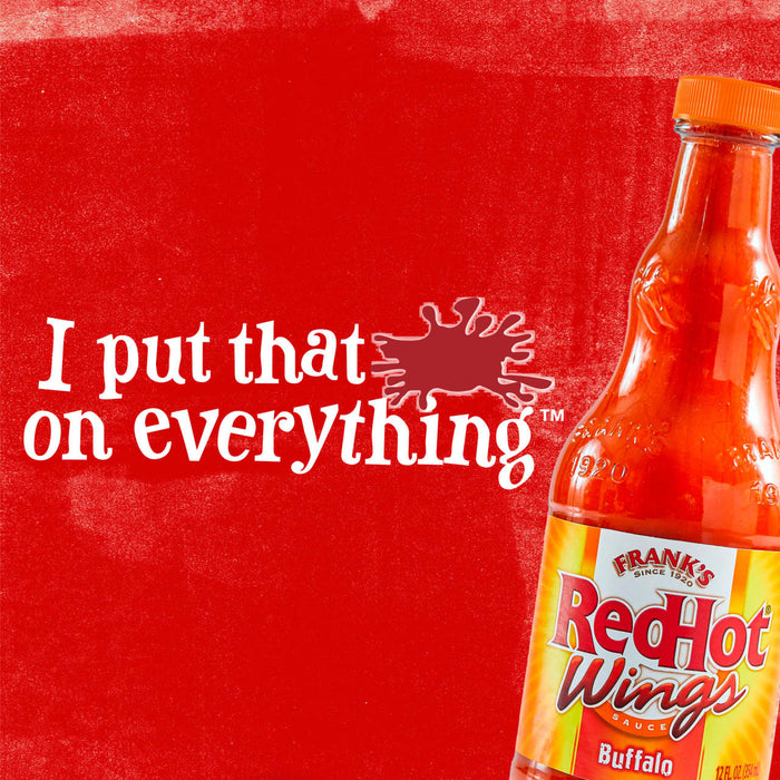 A bottle of Frank\s RedHot Buffalo Wing Sauce with the tagline I put that on everything on a red background.