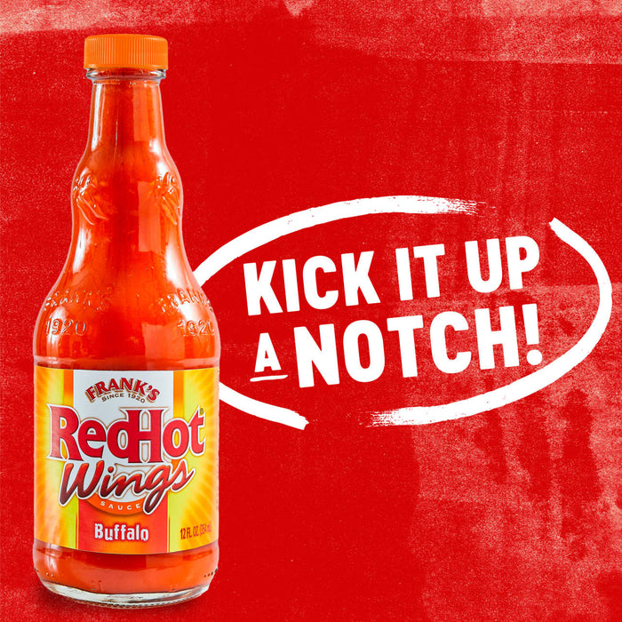 A bottle of Franks RedHot Buffalo Wing Sauce with the text Kick it up a notch! in a white circle.