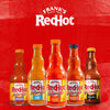 Five bottles of Franks RedHot Wings sauce in different flavors.