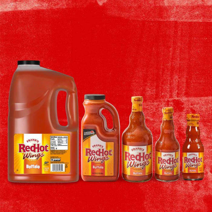 ["A collection of Frank's RedHot Buffalo Wing Sauce bottles in various sizes."]