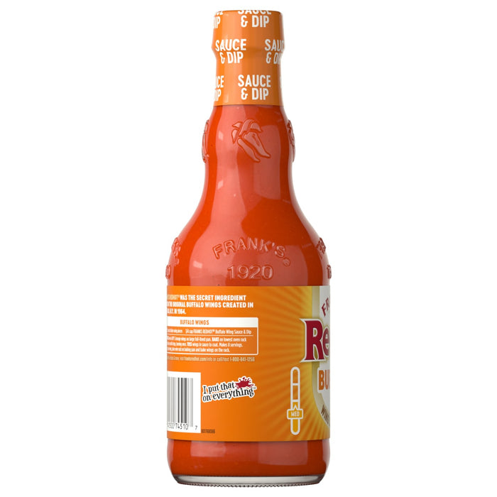 The back of a bottle of Franks Red Hot Buffalo Wing Hot Sauce Red Hot 12 Oz displays the brand's history and a recipe for Buffalo wings.