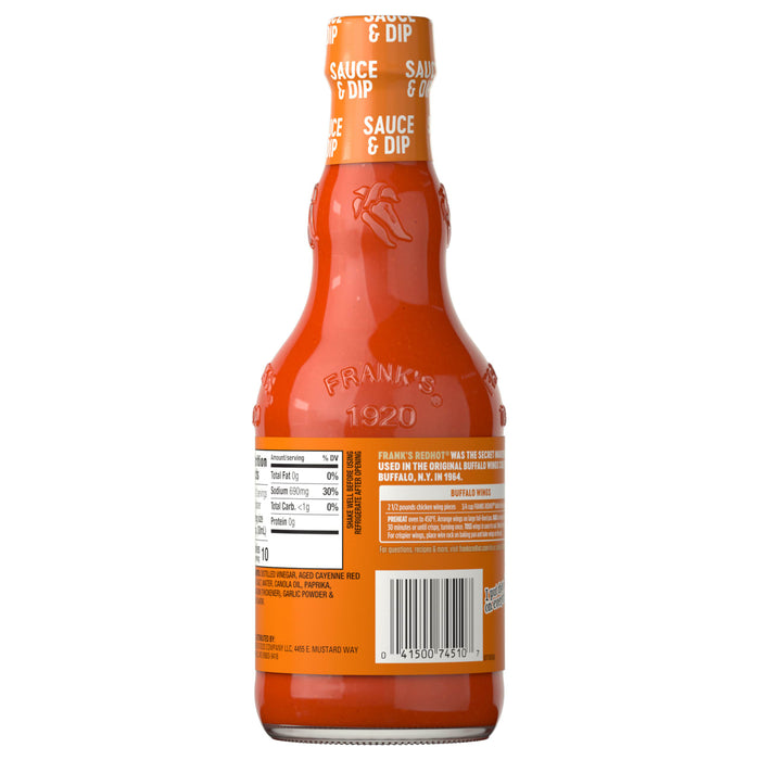 The back of a glass bottle of Franks Red Hot Buffalo Wing Hot Sauce Red Hot 12 Oz shows the nutritional information and a recipe for Buffalo wings.