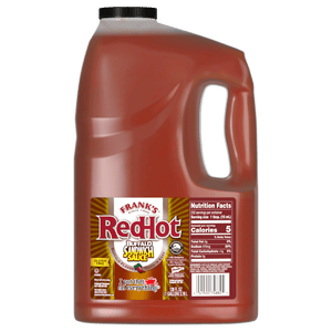 ["A gallon jug of Frank's RedHot Buffalo Sandwich Sauce."]