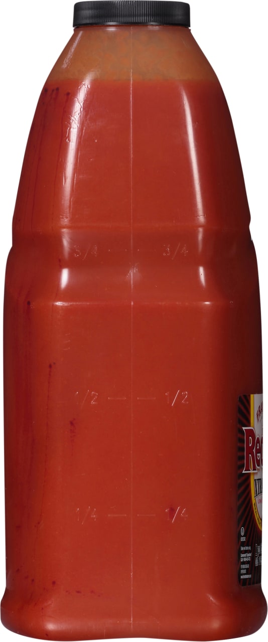 ["A red plastic bottle of Frank's RedHot Original Cayenne Pepper Sauce."]