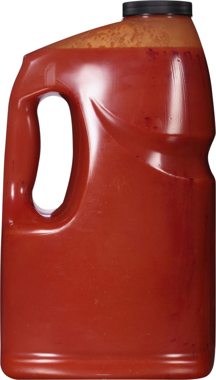['A red plastic jug with a black lid.']