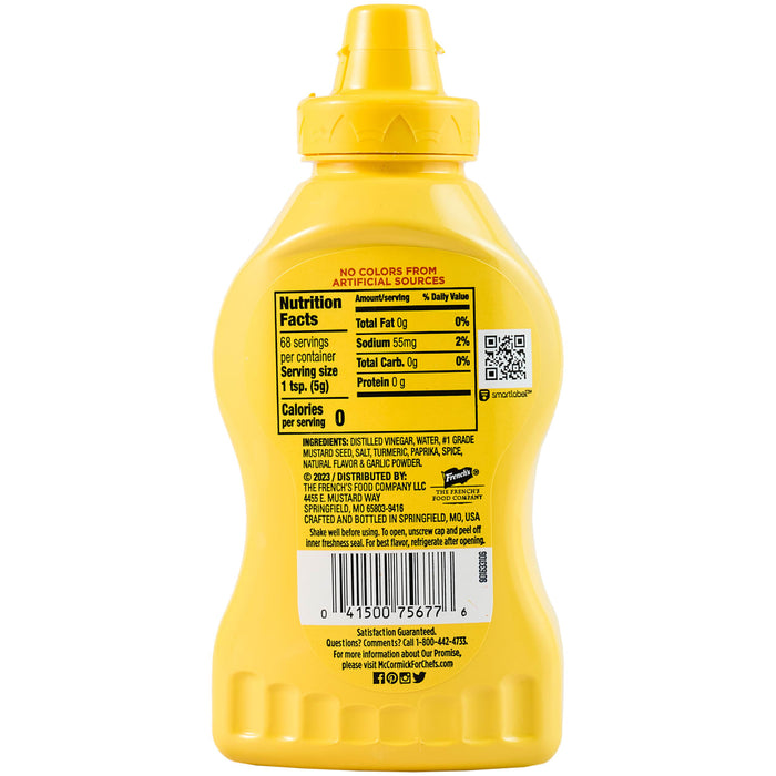 ["A bottle of French's Yellow Mustard with nutritional information on the label."]