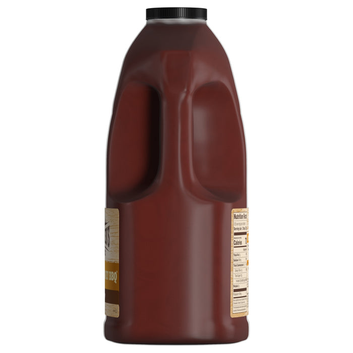 ['A plastic bottle of barbecue sauce with a label that says Honey BBQ.']