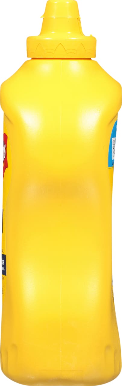 ["A yellow plastic bottle of French's Mustard."]