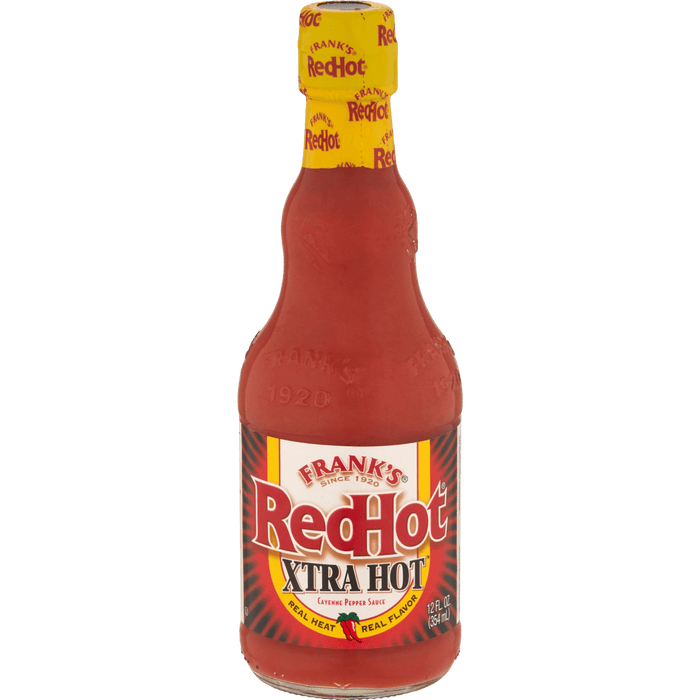 A bottle of Frank's RedHot XTRA Hot Cayenne Pepper Sauce.