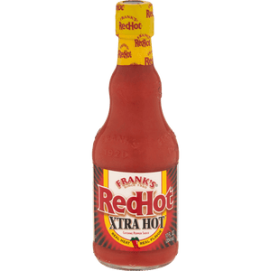 A bottle of Frank's RedHot XTRA Hot Cayenne Pepper Sauce.