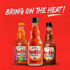 Three bottles of Frank's RedHot hot sauce, one for buffalo wings, one original, and one dill pickle.