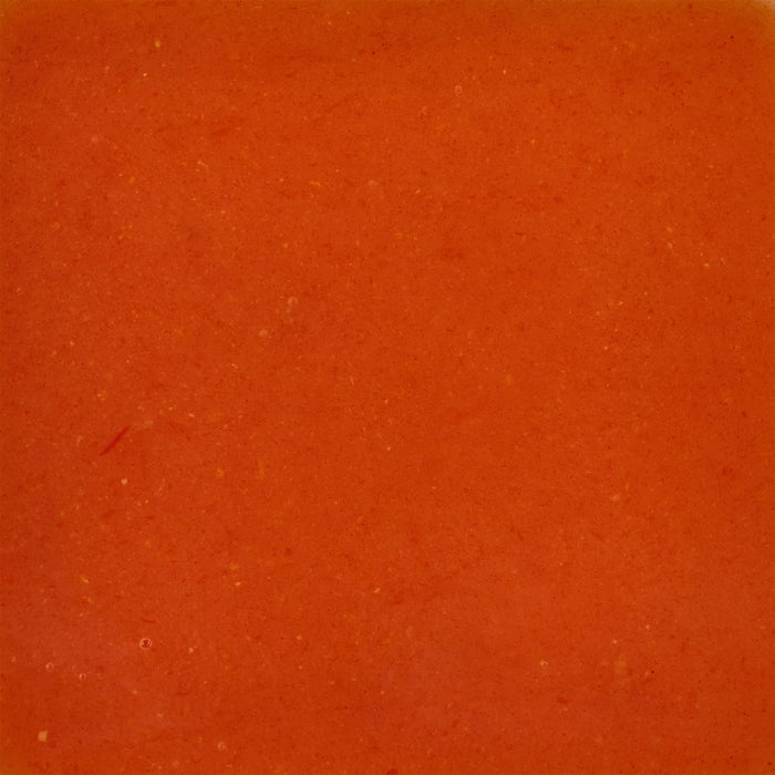 A close-up of a smooth orange sauce.