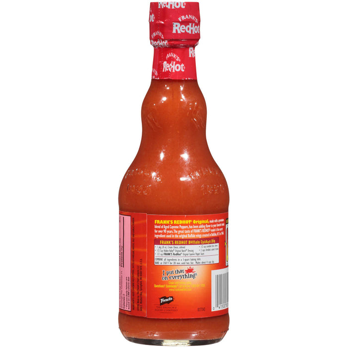 A bottle of Franks RedHot Original hot sauce with a recipe for Buffalo Chicken Dip on the label.