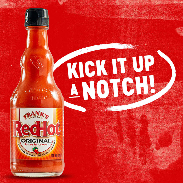 A bottle of Frank\s RedHot Original Cayenne Pepper Sauce with the text Kick it up a notch! in a white circle.