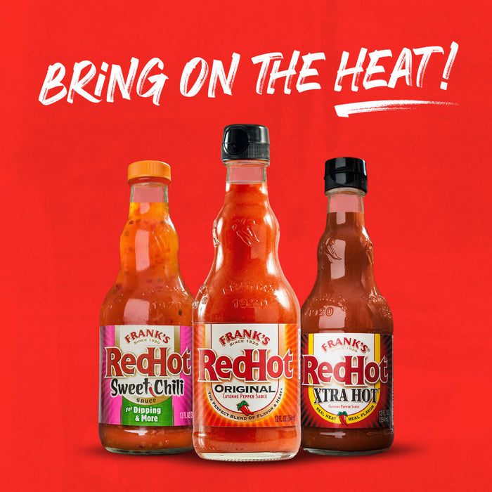 Three bottles of Frank's RedHot sauce, Sweet Chili, Original, and Extra Hot.