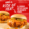 A sandwich with fried chicken, pickles, and a spicy sauce, with text that reads Adds a kick of heat &amp; a whole lot of flavor to favorite foods.