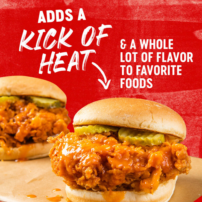A sandwich with fried chicken, pickles, and a spicy sauce, with text that reads Adds a kick of heat &amp; a whole lot of flavor to favorite foods.
