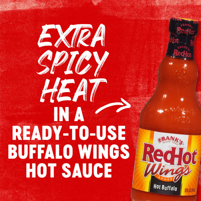 A bottle of Frank\'s RedHot Wings Hot Buffalo Sauce with the text Extra Spicy Heat in a Ready-to-Use Buffalo Wings Hot Sauce on a red background.