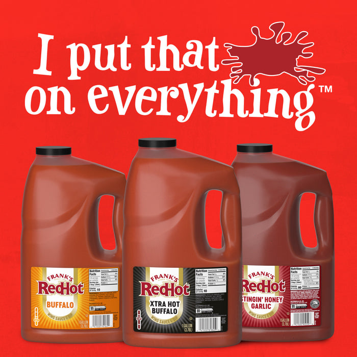 Three gallon jugs of FrankS Redhot Buffalo Wing Sauce, featuring Buffalo, Xtra Hot Buffalo, and Stingin Honey Garlic flavors, are displayed against a textured red background with the slogan I put that on everything.