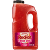 A large bottle of Frank's RedHot Sweet Chili Sauce is displayed.
