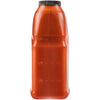 ['A bottle of tomato juice is filled to the 3/4 mark.']