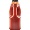 ['A red plastic bottle of hot sauce.']