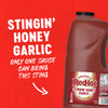A promotional graphic for Franks Red Hot Garlic Regular Hot Sauce Regular 128 Oz features a large gallon jug of Stingin Honey Garlic Wing Sauce and Dip against a vibrant red background with bold white text.