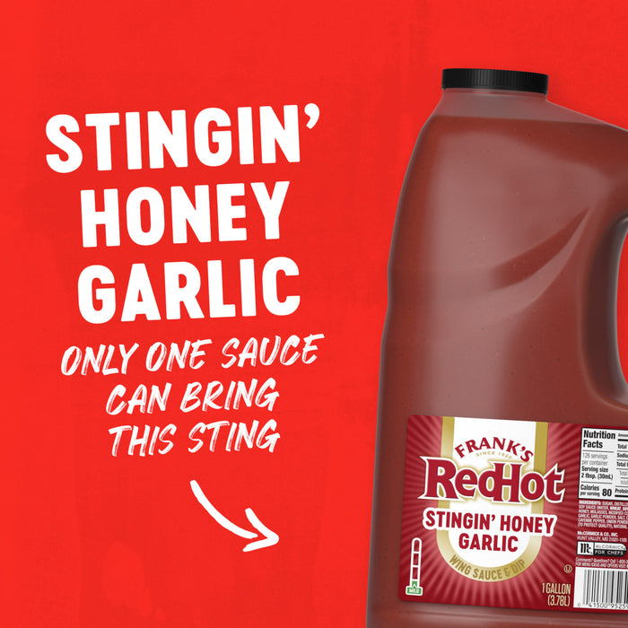A promotional graphic for Franks Red Hot Garlic Regular Hot Sauce Regular 128 Oz features a large gallon jug of Stingin Honey Garlic Wing Sauce and Dip against a vibrant red background with bold white text.
