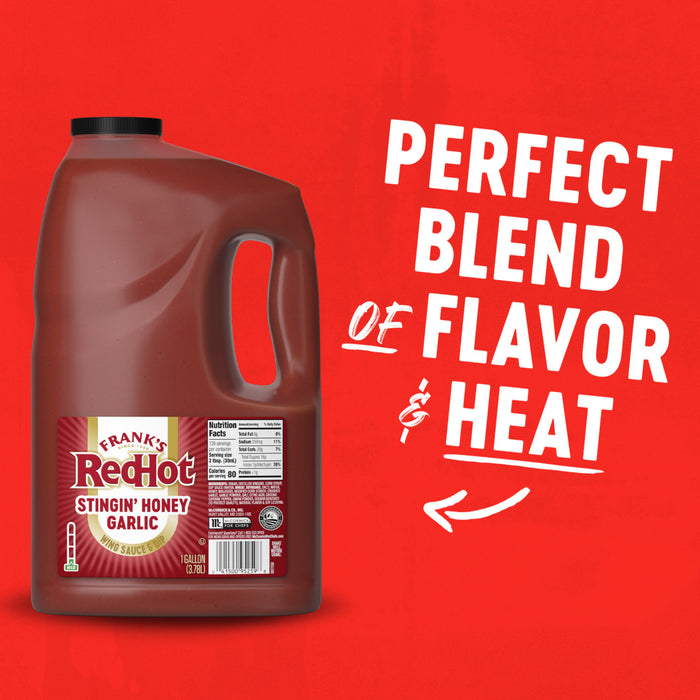 A one gallon jug of Franks Red Hot Garlic Regular Hot Sauce Regular 128 Oz is displayed against a vibrant red background with the text Perfect Blend of Flavor and Heat.