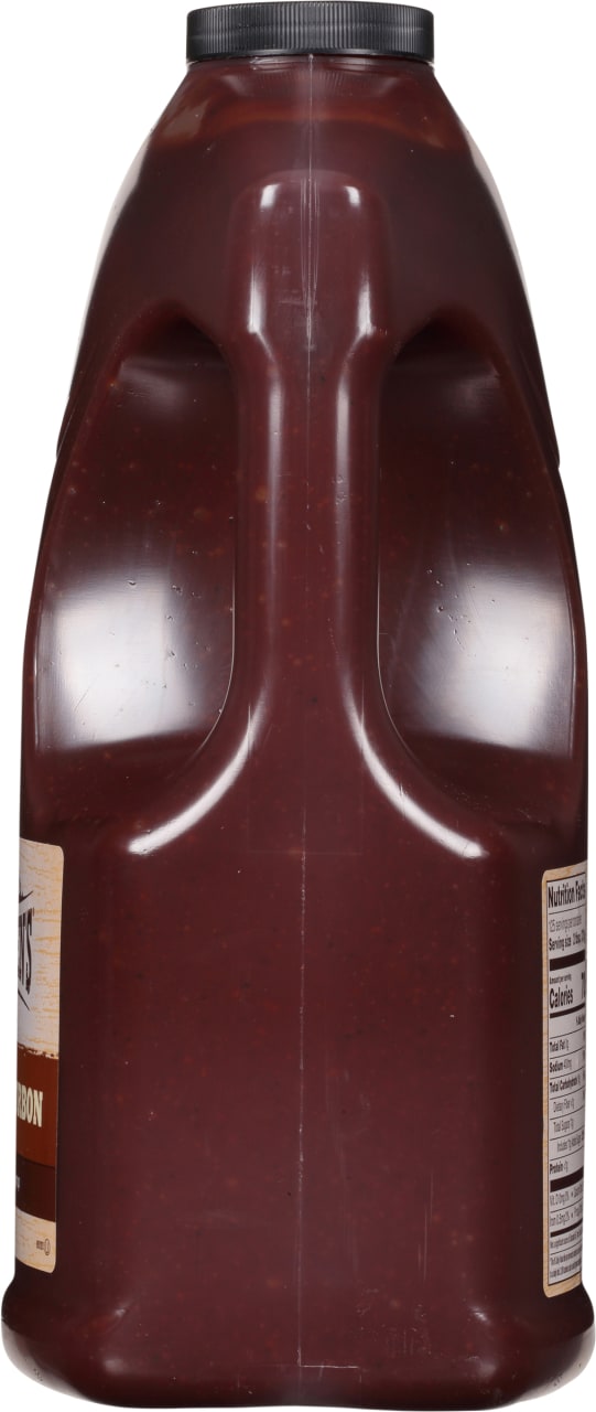 A plastic bottle of Sweet Baby Ray's Bourbon BBQ Sauce.