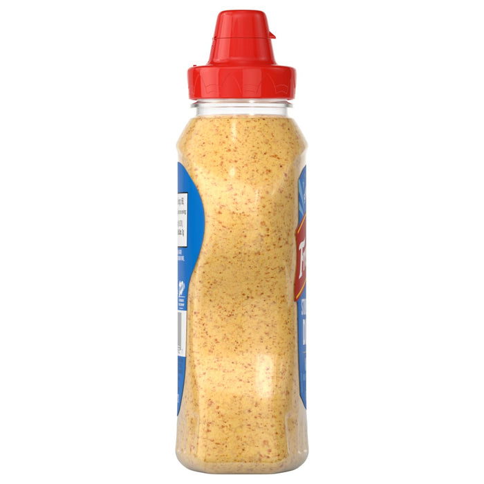 A bottle of Frenchs Beige Stone Ground Dijon Mustard 12 Oz stands upright, displaying its speckled, beige contents and black cap.