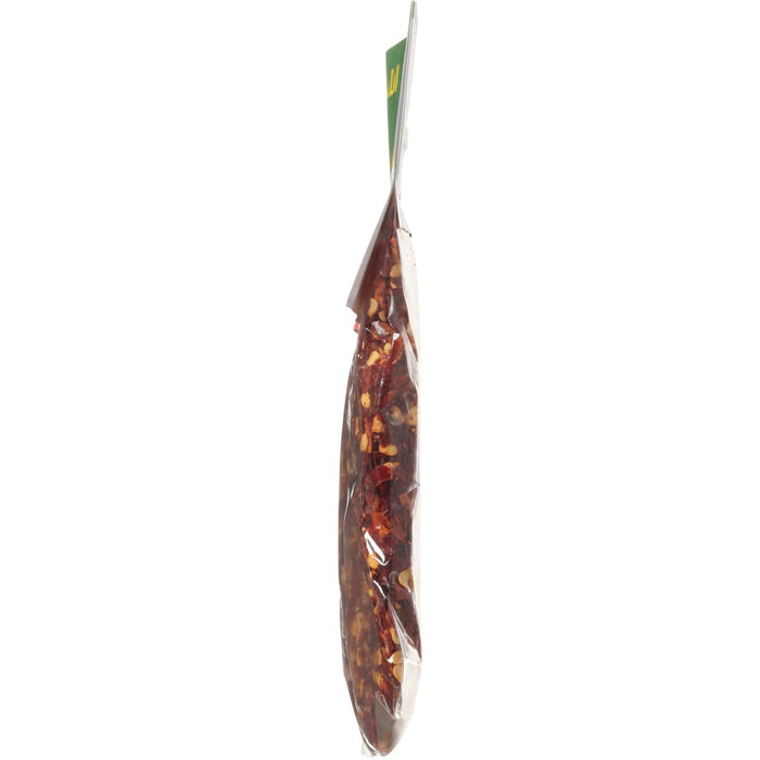 A side view of a bag of crushed red pepper flakes.