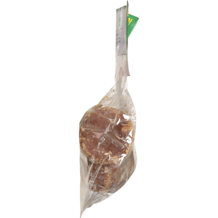 A close-up of a brown sugar block wrapped in plastic.