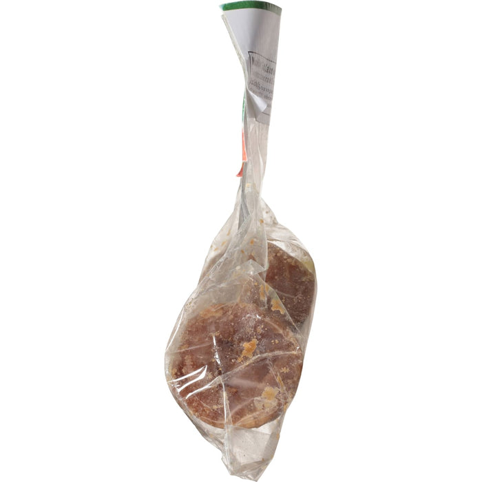 A close-up of two brown sugar cakes in a clear plastic bag.