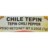 A close-up of a label for Chile Tepin Chili Pepper, with the weight listed as 0.25 oz (7g).