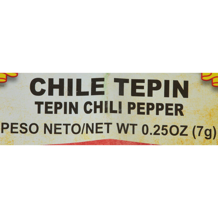 A close-up of a label for Chile Tepin Chili Pepper, with the weight listed as 0.25 oz (7g).