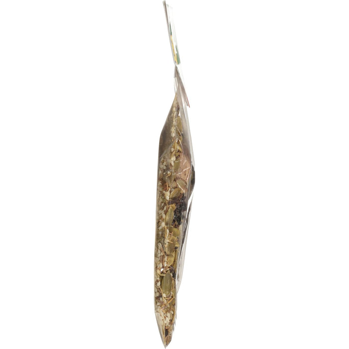 A side view of a clear plastic bag filled with a mix of seeds and spices.