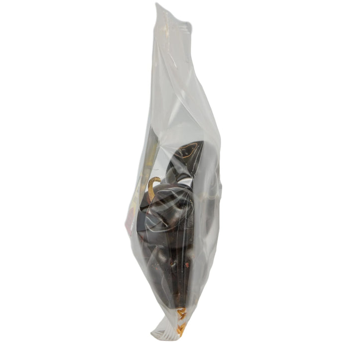 A plastic bag filled with dried black peppers.