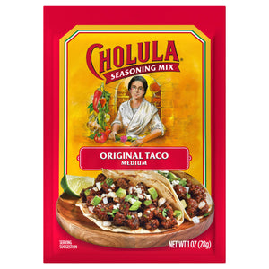 A package of Cholula Original Taco Seasoning Mix, with a serving suggestion of tacos on a wooden plate.