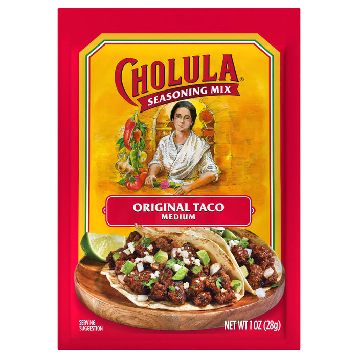A package of Cholula Original Taco Seasoning Mix, with a serving suggestion of tacos on a wooden plate.