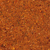A close up view shows the vibrant and textured blend of spices that make up the Cholula Medium Taco Seasoning Mix 1 Oz.