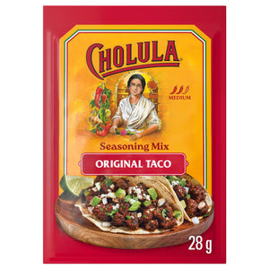 A 28 gram packet of Cholula Medium Taco Seasoning Mix 1 Oz featuring the iconic brand logo and an illustration of a woman preparing fresh ingredients above a photo of two street tacos.