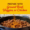A skillet of browned ground beef is being seasoned with Cholula Medium Taco Seasoning Mix 1 Oz under text suggesting it can also be prepared with veggies or chicken.