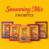 A vibrant yellow promotional graphic showcases a variety of seasoning packets including the Cholula Medium Chili Garlic Taco Seasoning Mix 1 Oz alongside other flavors like Pork Carnitas and Al Pastor.