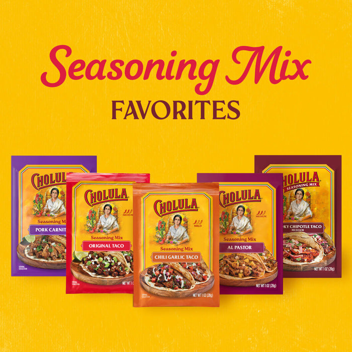 A vibrant yellow promotional graphic showcases a variety of seasoning packets including the Cholula Medium Chili Garlic Taco Seasoning Mix 1 Oz alongside other flavors like Pork Carnitas and Al Pastor.